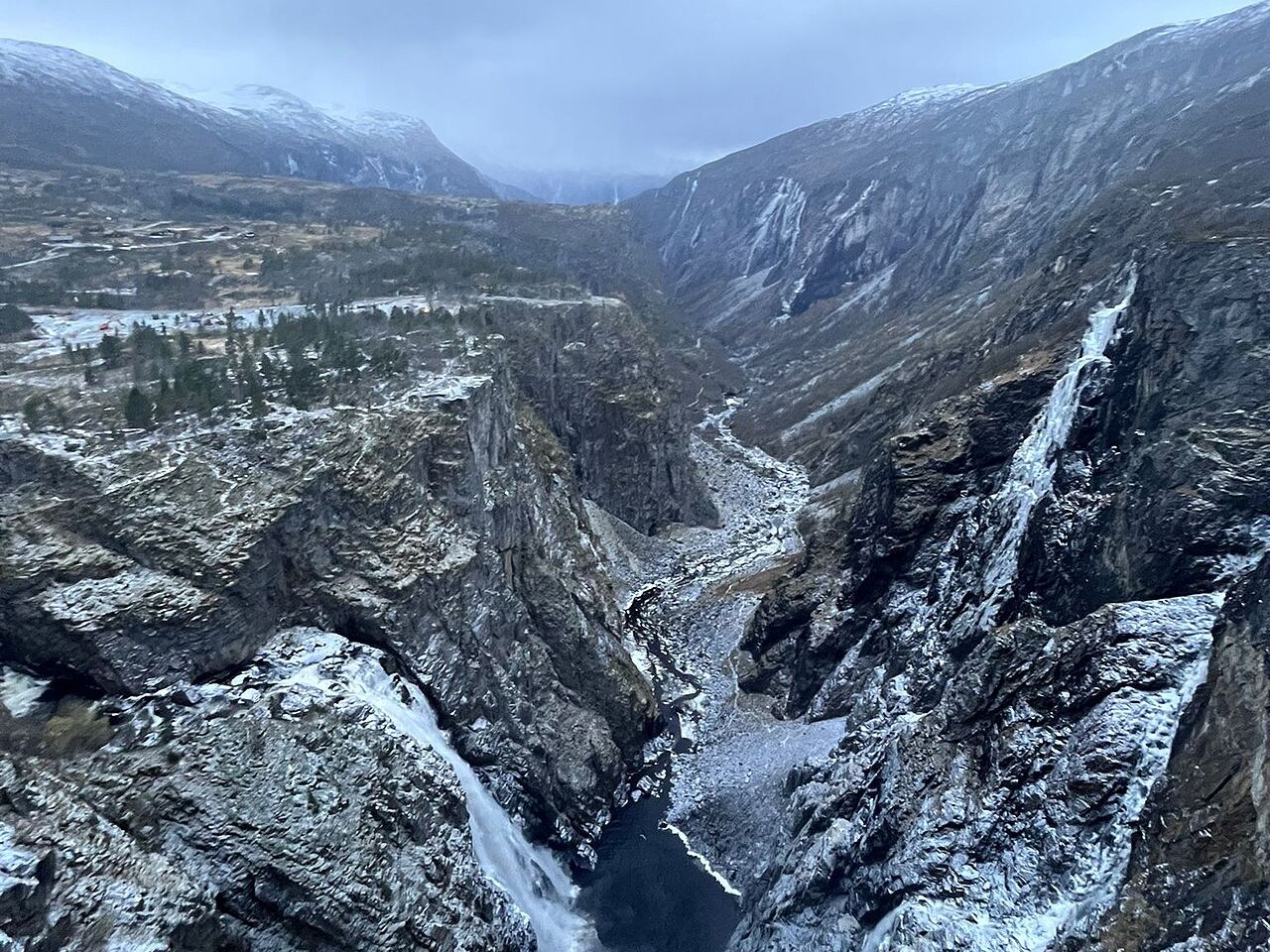 Vøringsfossen falling into a deep, snow-dusted canyon